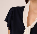 Flutter Sleeve Tie Neck Knit Top In Navy Ivory 3