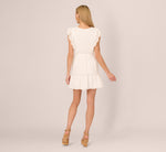 Sleeveless Ruffle Eyelet Mini Dress In Ivory 5