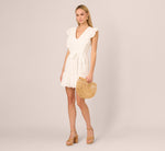 Sleeveless Ruffle Eyelet Mini Dress In Ivory 1