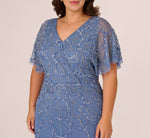 Plus Size Flutter Sleeve Surplice Beaded Gown In French Blue 3